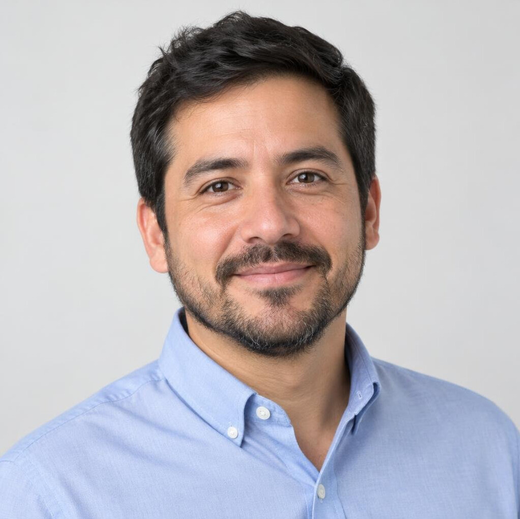 Portrait of a bearded Latino man in a casual shirt